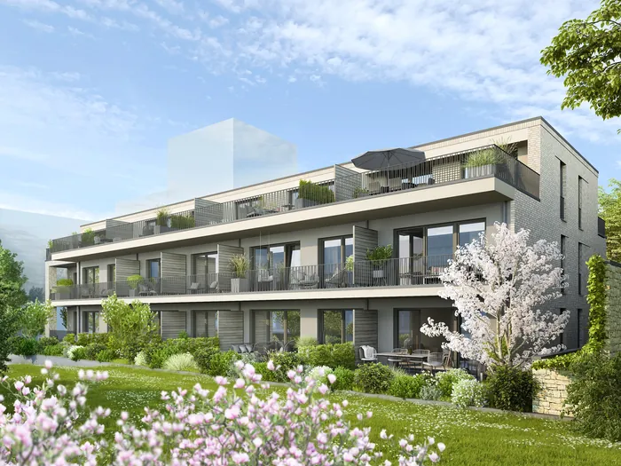 Modern residential building with balconies and lush garden by Oliver Hasselluhn