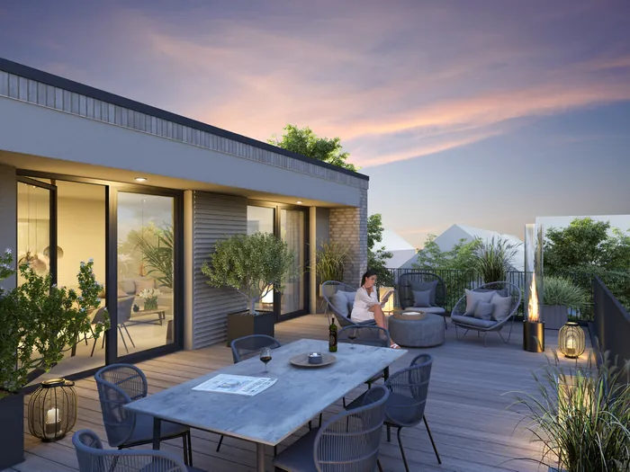 Modern rooftop terrace with seating area and plants at sunset by Oliver Hasselluhn