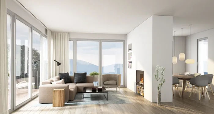 Spacious living room with sofa, large windows, and natural light