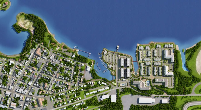 Aerial coastal town view showing docks, houses, and roads