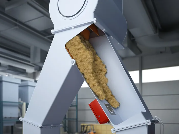 Industrial machine with granular material in factory setting