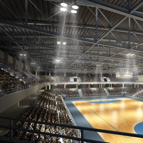 Indoor sports court with handball goal and audience seating