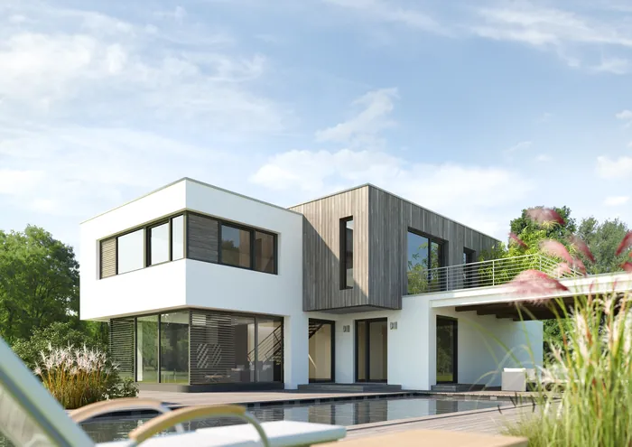 Contemporary two-story home with pool and large glass windows