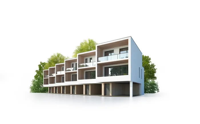 Row of modern white townhouses with balconies and garages