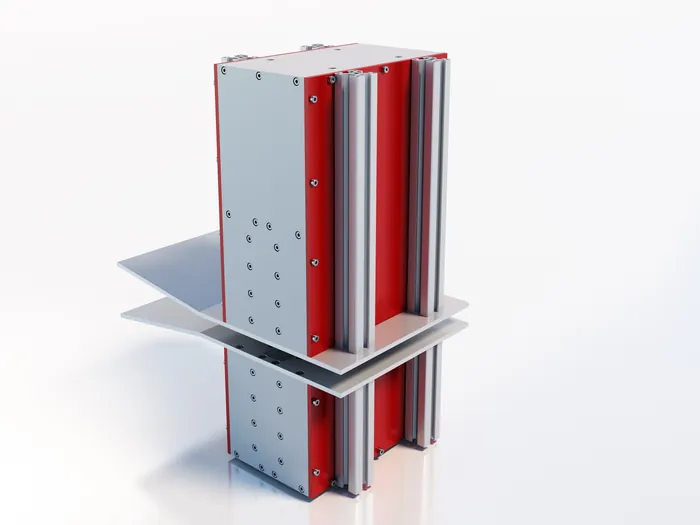 Metallic red and silver structural beam connector on reflective surface