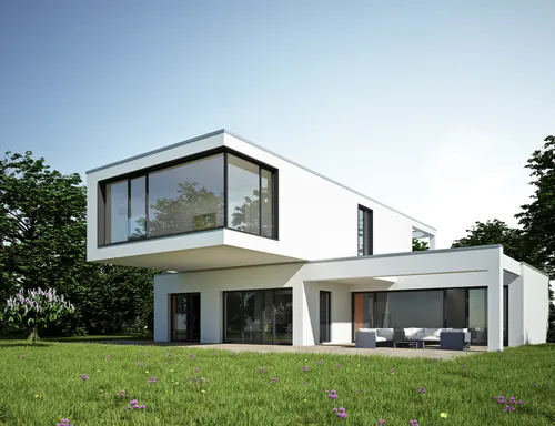 Modern white two-story house with large glass windows and outdoor seating