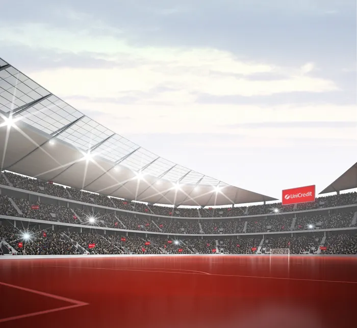 Empty soccer stadium with floodlights and seats by Oliver Hasselluhn