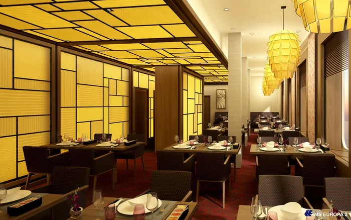 Modern Asian-style restaurant interior with yellow lighting and dining tables by Oliver Hasselluhn