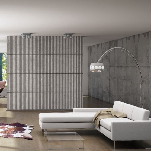 Modern living room with white sofa and large windows by Oliver Hasselluhn