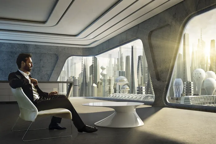 Man sitting in futuristic office with city view by Oliver Hasselluhn