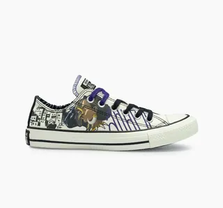 White sneaker with black and purple patterns and laces