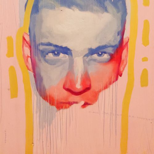 Surreal man's face with blue and red paint on pink background