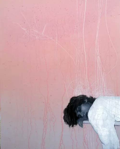 Person resting head on pink textured wall