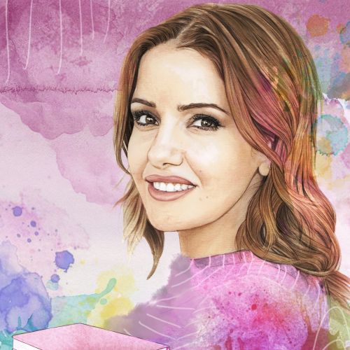 Smiling woman with brown hair holding colorful books with watercolor effects