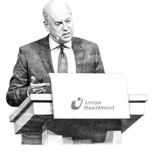 Man in suit giving a speech at Union Investment podium