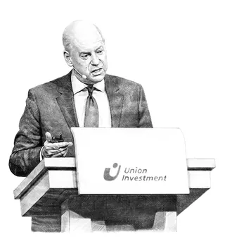 Man in suit giving a speech at Union Investment podium
