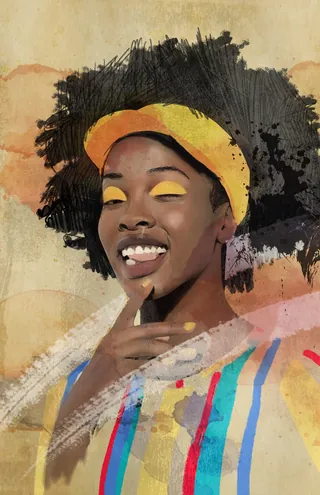Smiling woman with afro hair and yellow eyeshadow wearing a colorful outfit