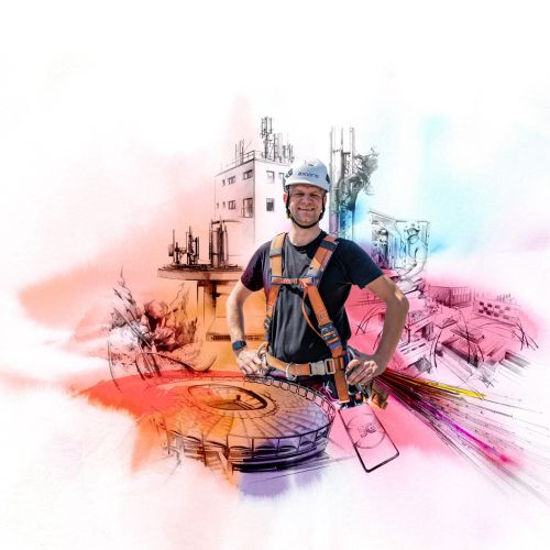 Engineer in harness and helmet at construction site with blueprints