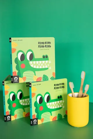 Children's book covers with cartoon crocodile illustrations and Korean text by Pintachan