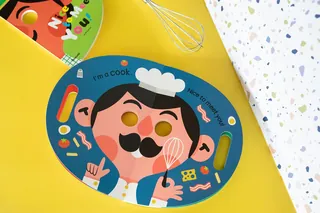 Cartoon chef face placemat with cooking utensils by Pintachan