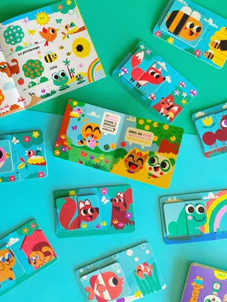 Bright animal puzzle pieces with birds, foxes, and fish by Pintachan