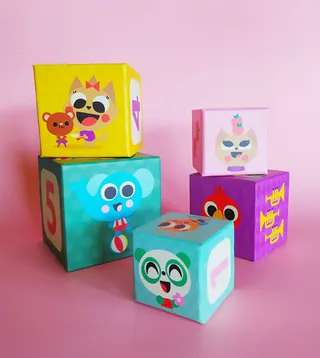 Stacked colorful cartoon character cubes by Pintachan on pink background