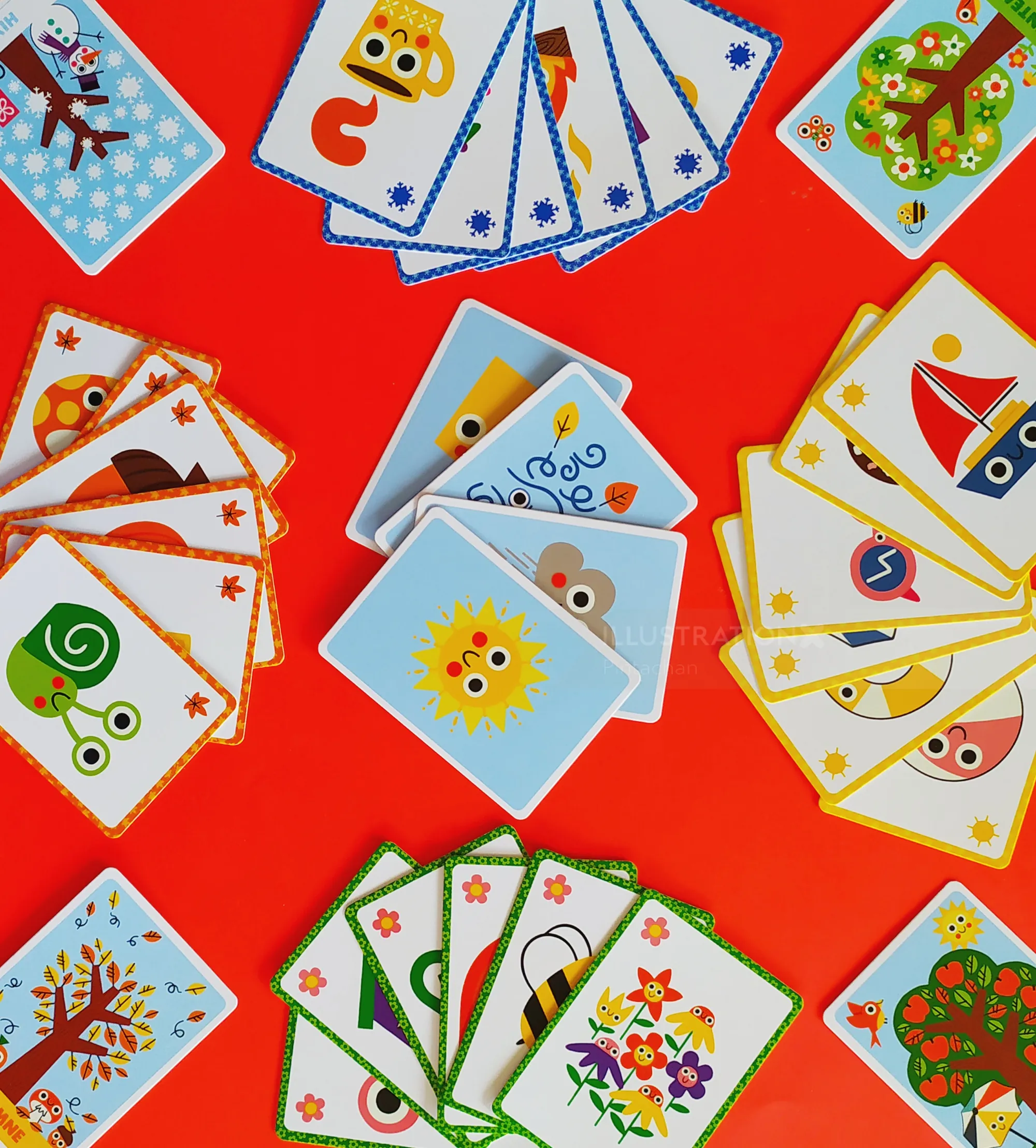 Colorful illustrated playing cards featuring cartoon designs by Pintachan