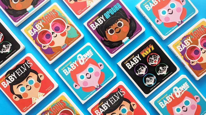 Assorted colorful baby-themed collectible pins with cartoon faces