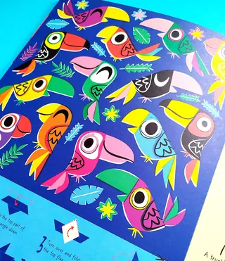 Illustration of colorful toucans with tropical leaves and flowers