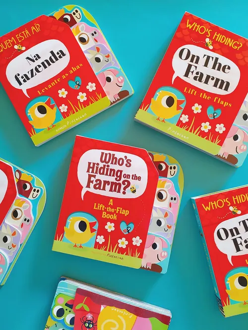 Children's colorful farm-themed lift-the-flap books in English and Portuguese