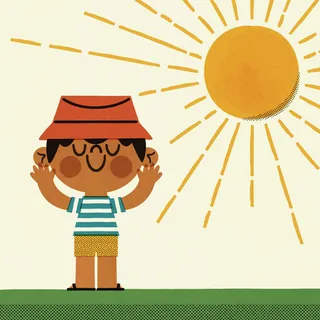 Happy child with a hat standing in sunlight