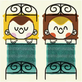 Two smiling children tucked in bed with wrought iron headboards