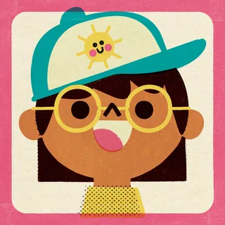 Smiling child with round glasses and a sun-themed cap