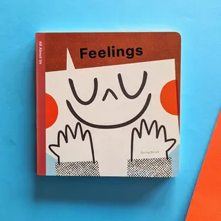 Cover of 'Feelings' board book with smiling character on blue background