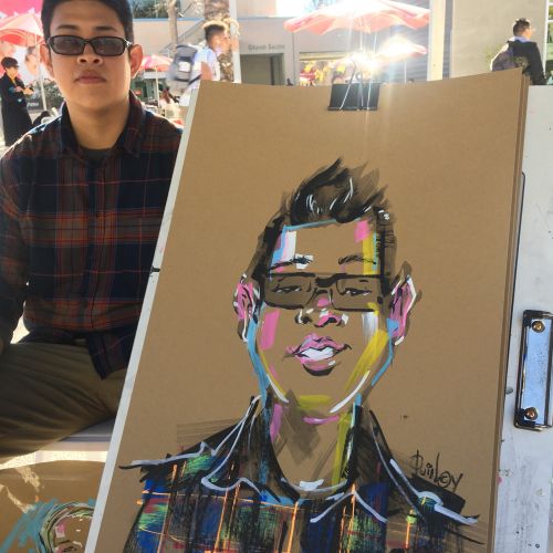 Live event drawing boy with glasses
