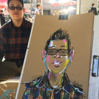 Live event drawing boy with glasses
