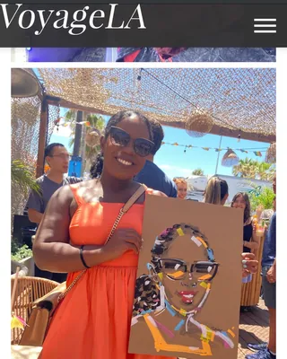 Woman in orange dress holding a colorful pop art portrait by Quincy Sutton Live Event Drawing