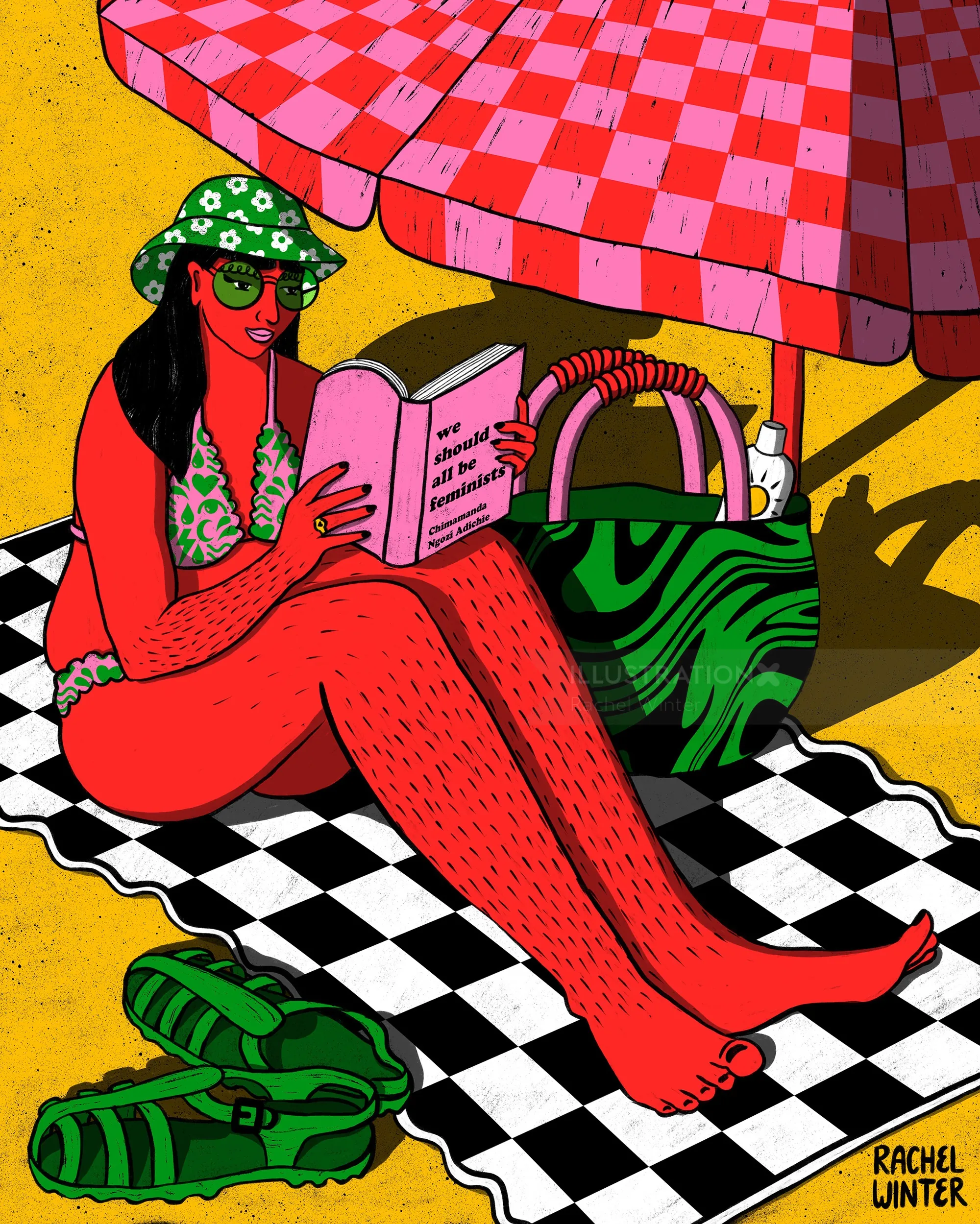 Frau liest Buch auf Strandtuch unter Sonnenschirm von Rachel Winter