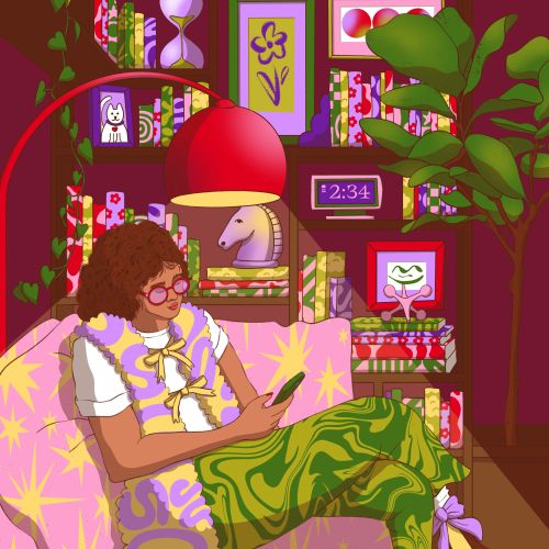 Person reading on couch with cat nearby in a vibrant, cozy room.