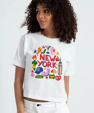 Woman in white T-shirt featuring colorful New York illustrations