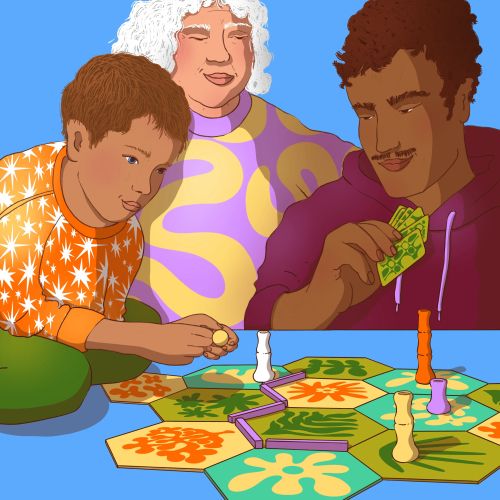Three individuals playing a vibrant board game indoors.