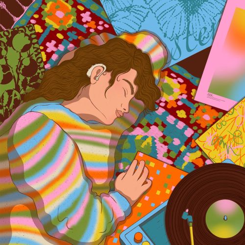 Person reclining near colorful patterned fabrics and a vinyl turntable by Rachel Winter