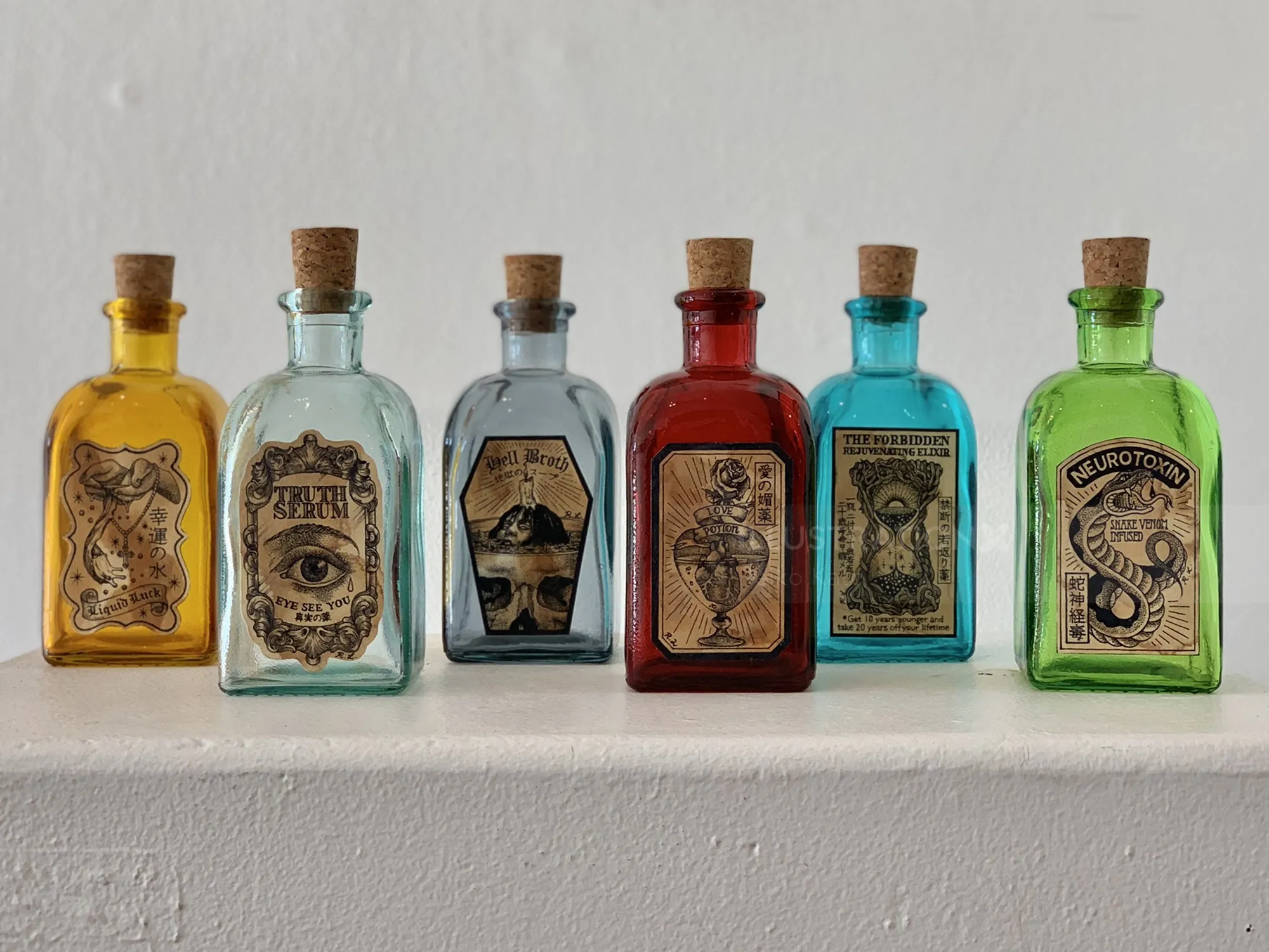 Magic potion bottles with vintage labels by Reiko Lauper