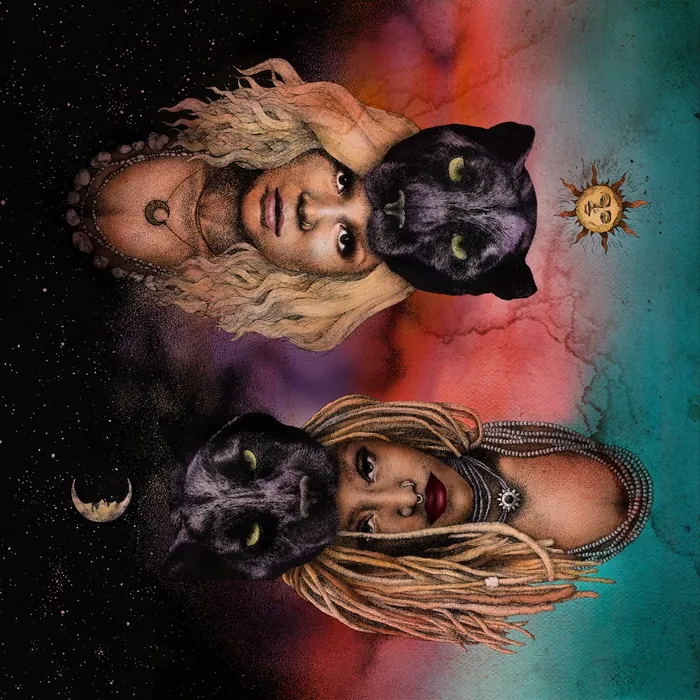 Two women with black panther masks against vibrant colorful background by Reiko Lauper