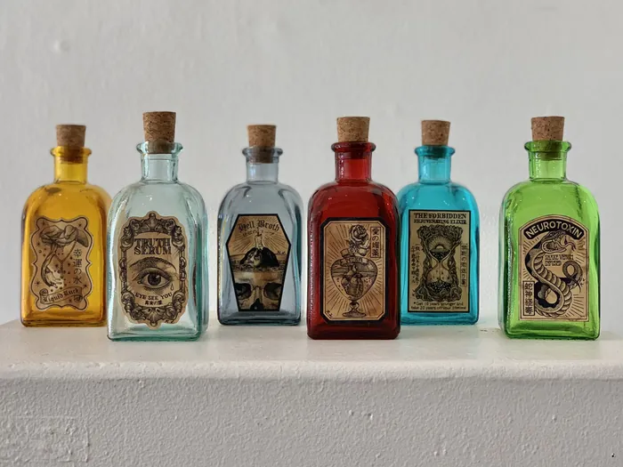 Magic potion bottles with vintage labels by Reiko Lauper