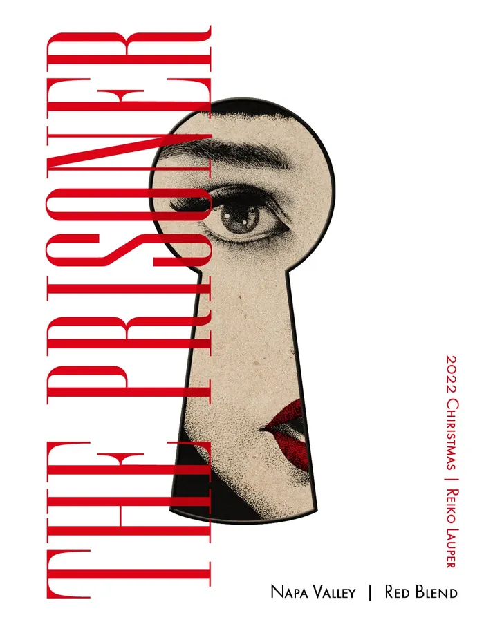 Wine label showing partial woman's face viewed through keyhole by Reiko Lauper