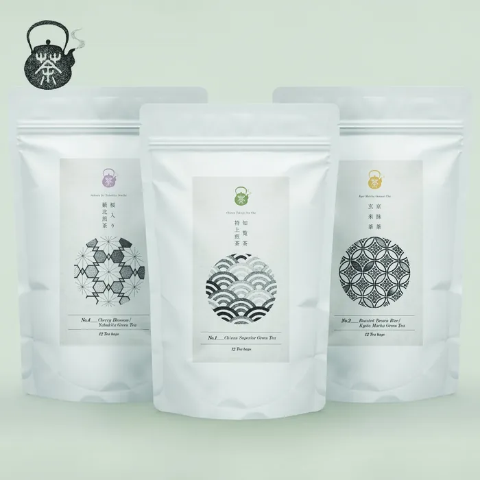 Three white tea pouches with Japanese patterns by Reiko Lauper
