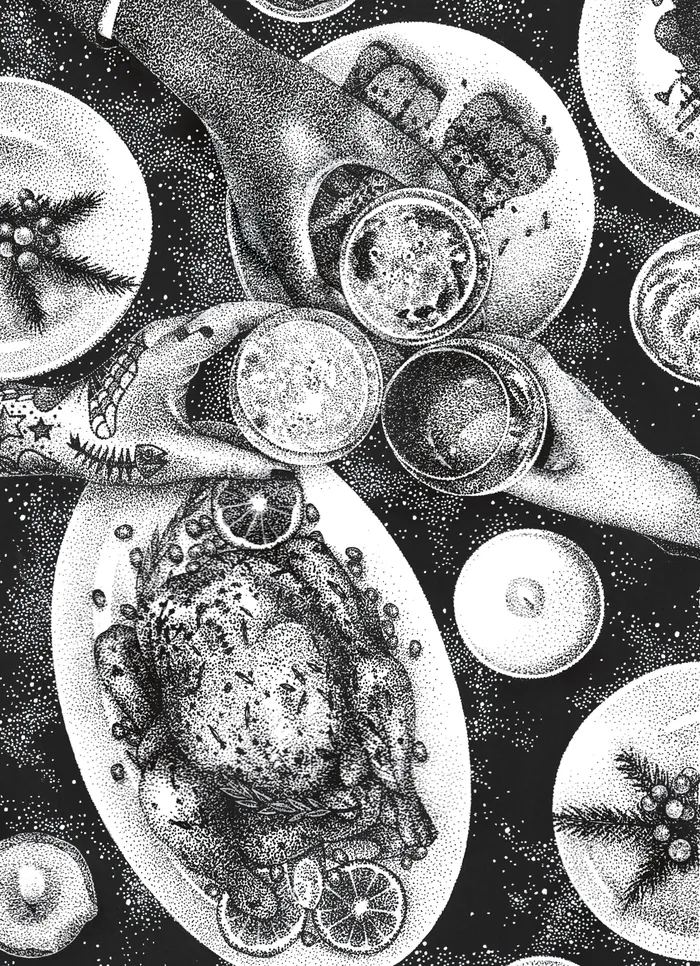 Overhead view of roasted chicken with lemon slices and drinks on table
