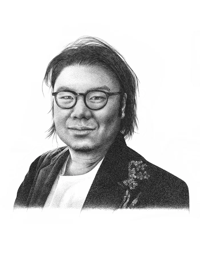 Monochrome portrait of a man wearing glasses and a jacket