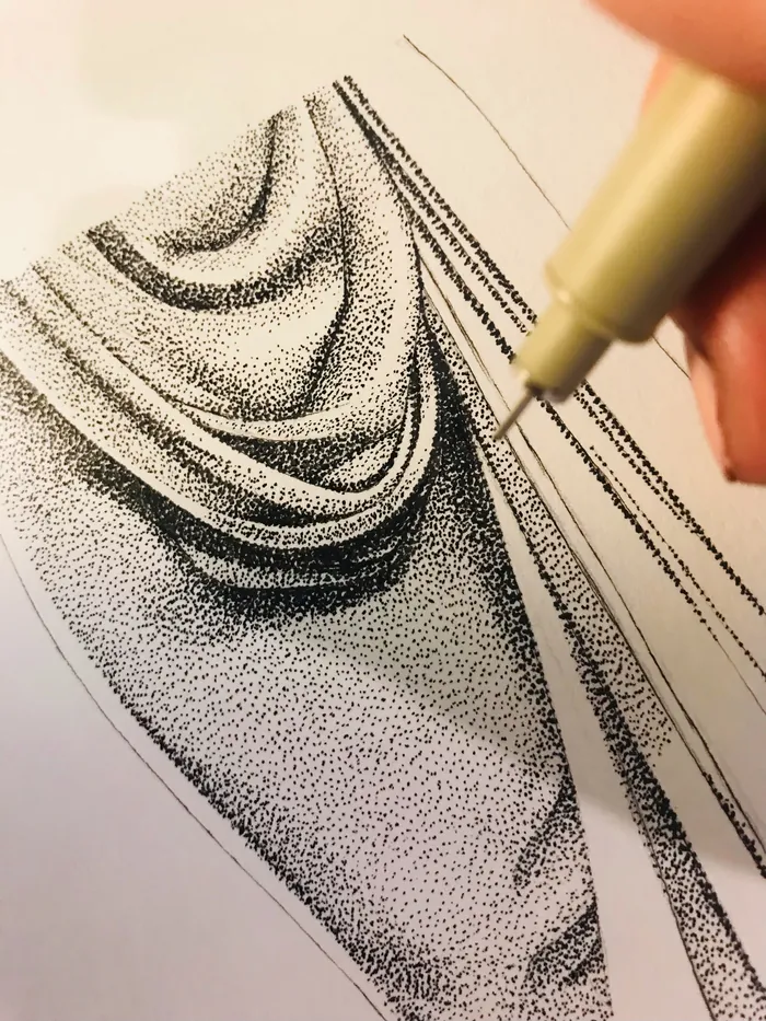 Hand drawing fabric folds using stippling technique with pen